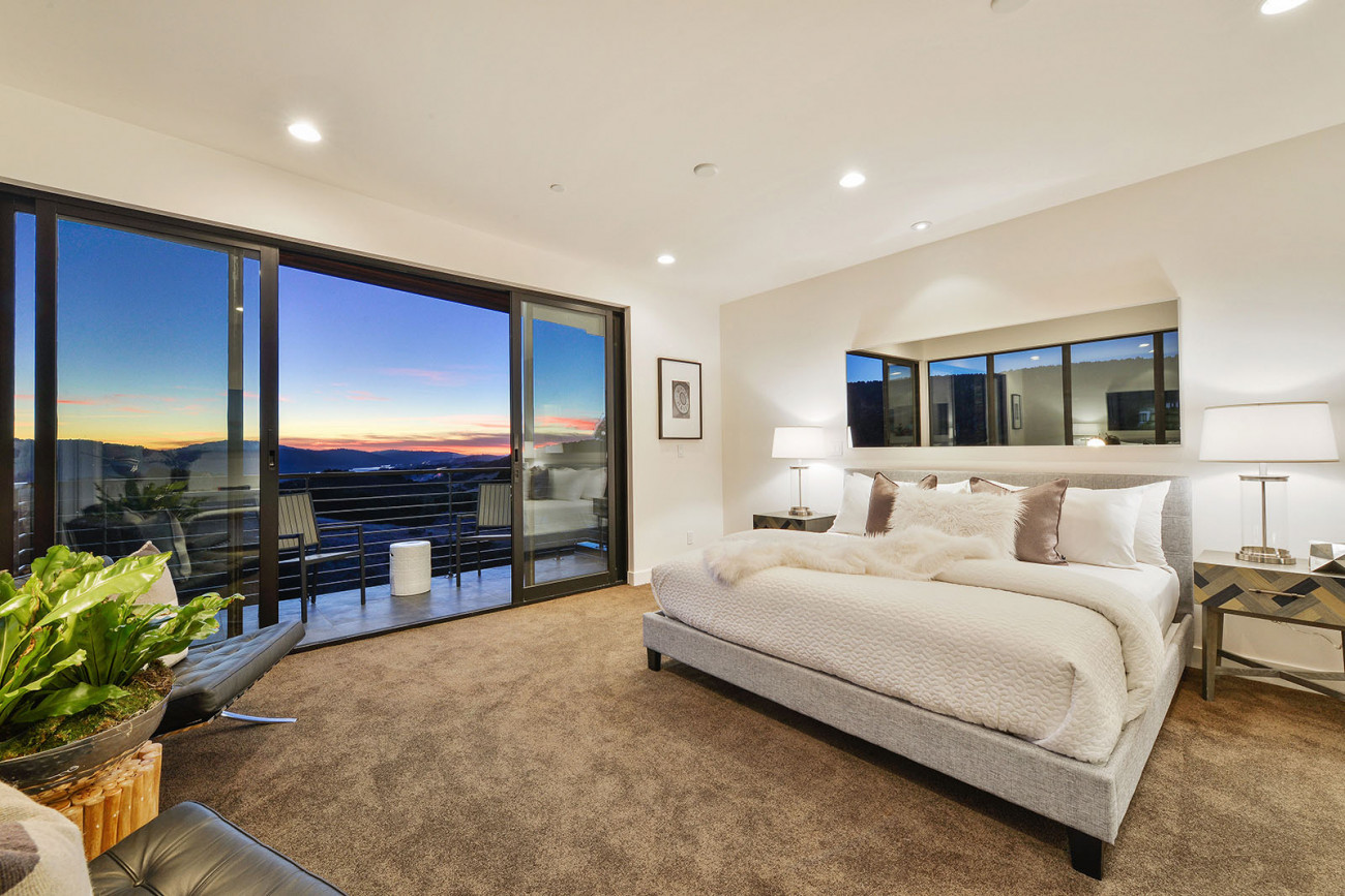 481 West Maple master bedroom with floor to ceiling windows windows at sunset