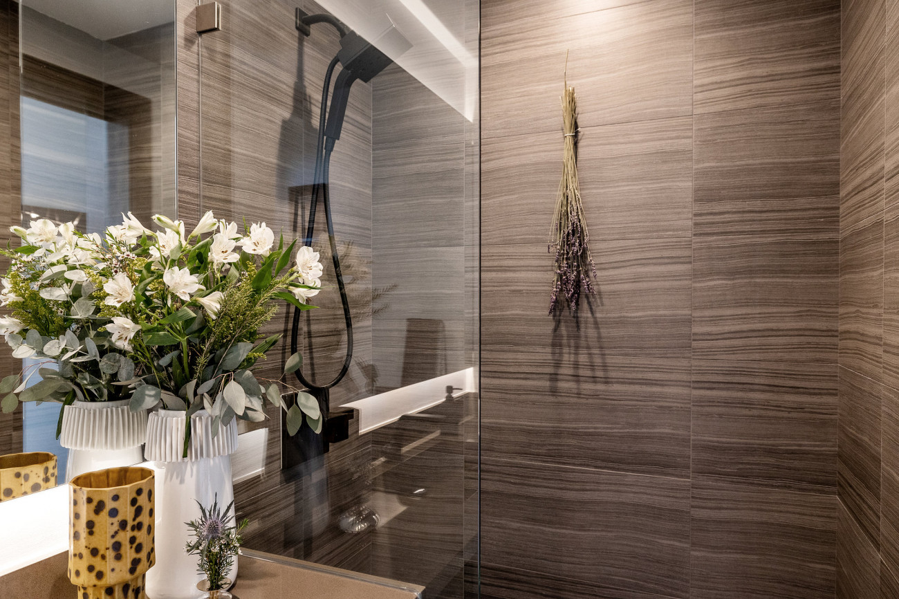 Guest shower with glass doors.