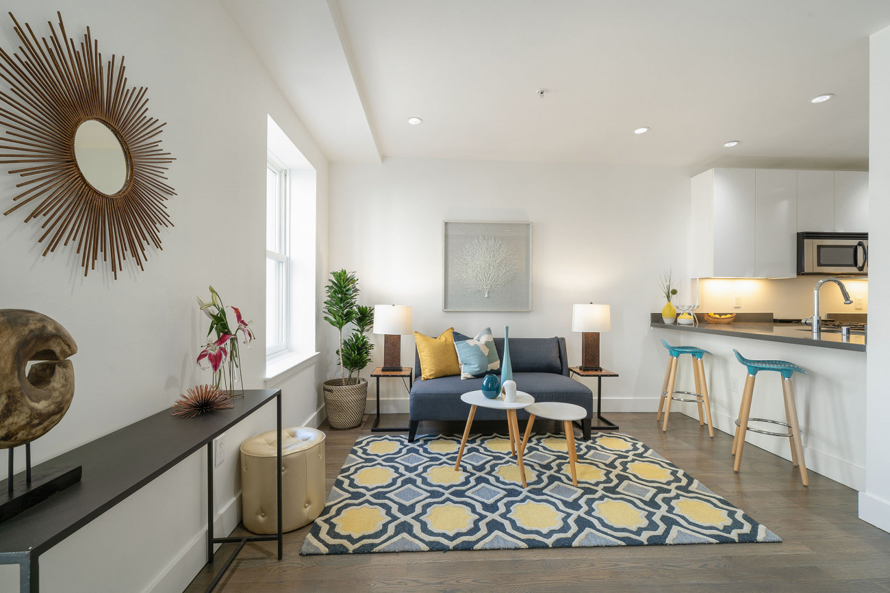 901 Bush long view of living area with blue and yellow rug